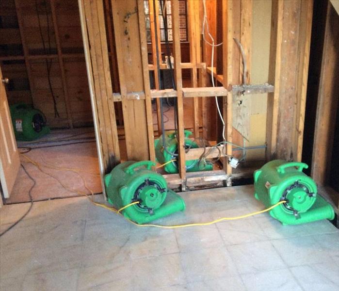 inside of water damaged home, drywall and flooring removed